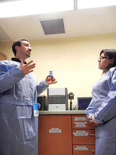Dr. Gonzalo Alvarez explains how the Qikiqtani General Hospital's TB-tester works to Nunavut MP Leona Aglukkaq, then the federal health minister, in March 2012 during a tour of the hospital's laboratory. (FILE PHOTO))