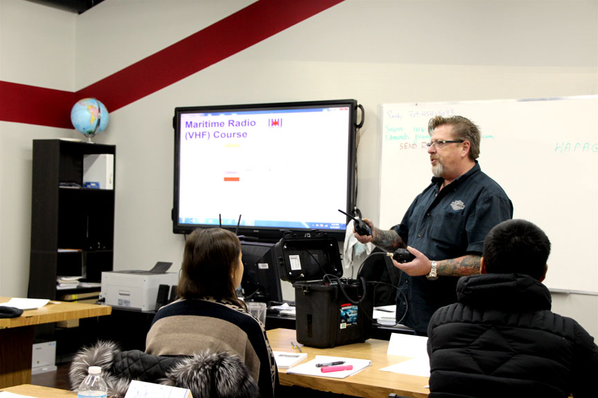 Randy Pittman of the Nunavut Fisheries and Marine Training Consortium teaches students at a Nunavut cruise ship training boot camp on how to operate a VHF marine radio during classroom time in Iqaluit last week. (PHOTO BY BETH BROWN)

