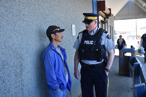 Staff-Sgt. Garfield Elliott stopped to chat with Salomonie Arnaquq outside the North Mart during his first foot patrol rounds this summer in Iqaluit. (PHOTO BY COURTNEY EDGAR)
