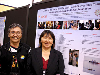 Paul Onalik of Kimmirut and Hannah Angoootealuk stand in front of a poster explaining the Qanuippitali Inuit health survey, which they presented at this week's International Congress of Circumpolar Health in Yellowknife. The two traveled throughout Nunavut on board the Amundsen when they worked on the 2007-08 Qanuippitali Inuit Health Survey. (PHOTO BY JANE GEORGE)