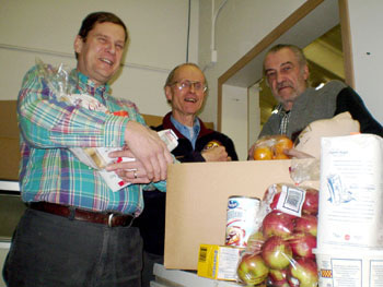Here's John Matthews, Mike Gardener and Yvon Blanchette in 2008, packing Christmas goodies for Iqaluit's annual hamper drive. (FILE PHOTO)