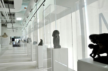 The museum’s bright, white space is meant to evoke the feeling of being on the tundra. Displayed here, the sculptures of artists Abraham POV, John Tiktak and Osuitok Ipeelee. (PHOTO BY SARAH ROGERS)