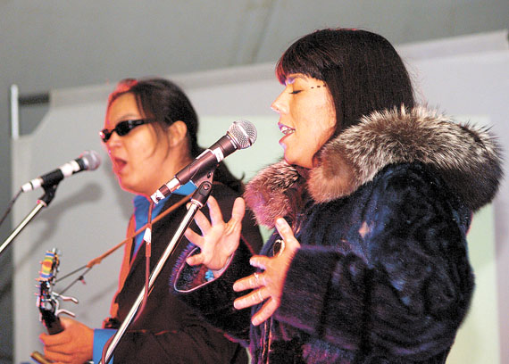 ShoShona Kish, left, and Raven Kanatakta of the band Digging Roots kick off the opening concert of the Alianait arts festival in Iqaluit this past June 22. This year, the festival will run only four days, from June 30 to July 3, a decision based on a community survey. (FILE PHOTO)