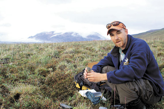 Bilodeau holding a brown lemming, June 2010. (PHOTO COURTESY OF AUDE LALIS)