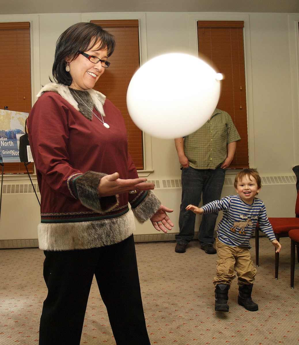 Nunavut Conservative MP Leona Aglukkaq plays with a balloon with her son Cooper during an election night party at Iqaluit's Frobisher Inn. Aglukkaq cruised to a second term as Nunavut's MP, winning nearly 50 per cent of the vote and easily outpacing her Liberal and New Democratic Party rivals. (PHOTO BY CHRIS WINDEYER)
