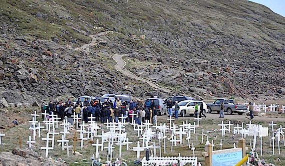 Mourners gather at the Iqaluit cemetery June 28 for the burial of Sylvain Degrasse, 44. Degrasse, his wife Sula Enuaraq and the couple’s two daughters were all found dead June 7. Enuaraq and her daughters Alexandra and Aliyah are expected to be buried in Pond Inlet this week. (PHOTO BY SARAH ROGERS)
