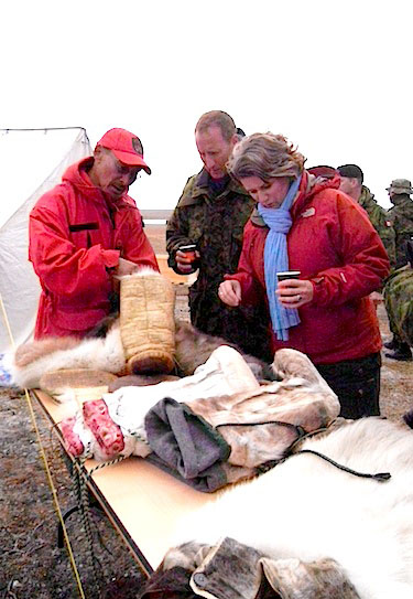 Canadian Ranger Jackie Amerlik of Arviat explains how traditional Inuit clothing is made to defence minister Peter Mackay and Gitte Lillelund Bech, Denmark's defence minister, Aug. 18 during their brief visit to Operation Nanook in Resolute Bay. (PHOTO BY JANE GEORGE)