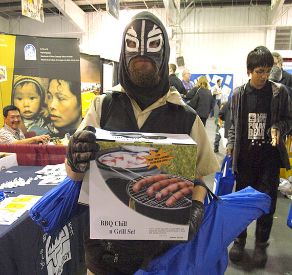 Iqaluit event mainstay Polarman poses with the prize package he won from the Qulliq Energy Corporation booth at the Nunavut Trade Show Sept. 29. The three-day event wrapped up Thursday with its annual public day and ensuing swag frenzy. (PHOTO BY CHRIS WINDEYER)