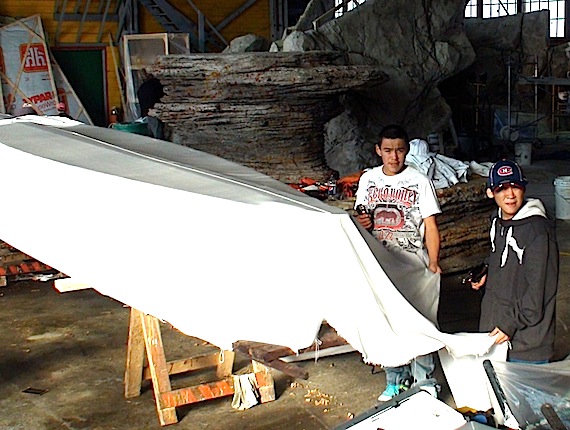 Iguarsivik students Noadamie Qumaluk and Charlie Sivuarapik traveled from Puvirnituq to Mingan on Quebec's Lower North Shore to attach the covers on to a pair of umiaks that they and their classmates made for the film 