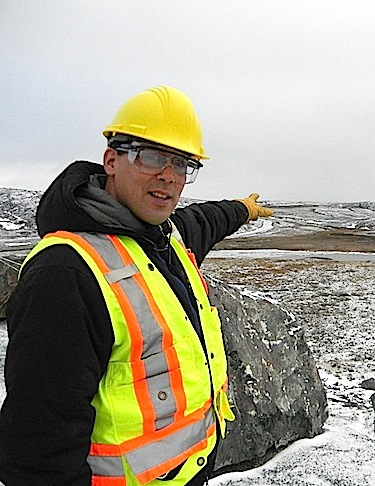 Alex Buchan, manager of community and external relations for Newmont in Cambridge Bay, points to a dammed lake near the Doris North camp. (PHOTO BY JANE GEORGE)