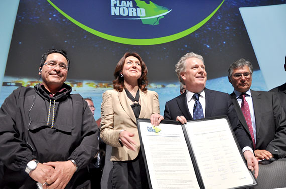 Pita Aatami, the president of Makivik Corp. (left), poses with Quebec cabinet minister Nathalie Normandeau and Quebec premier Jean Charest alongside other northern leaders at the May 9 launch in Lévis, Que., of the province's 25-year blueprint for the North. (FILE PHOTO)