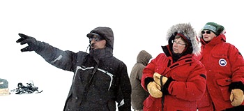 Kangiqsujuaq guide Yaaka M. Jaaka points out landmarks along Wakeham Bay to Nicole Ménard, Quebec’s minister for tourism, far right, and deputy minister Suzanne Giguère during a 2010 visit to Nunavik. (FILE PHOTO)