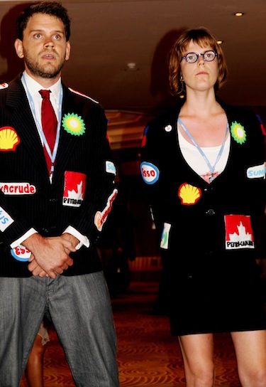Members of the Canadian youth delegation protest the Canadian government's negotiating position in Durban by dressing in 