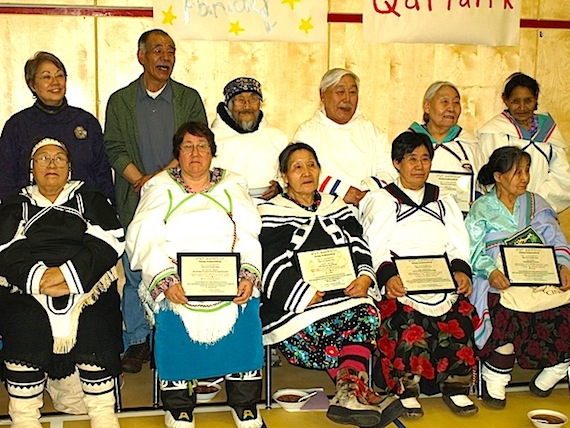 Premier Eva Aariak and MLA Louis Tapardjuk pose with a group of elders certified under the Education Act. (PHOTO COURTESY OF THE GN)