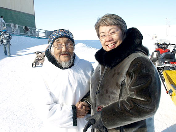 Abraham Ulayuruluk, recognized April 25 for his teaching expertise teaching in storytelling, drum-dancing, singing, hunting and tool-making, enjoys a moment outside with Premier Eva Aariak after the elders certification event in Igloolik. Read more about the first Innait Inuksiutilirijiit on Nunatsiaqonline.ca. (PHOTO COURTESY OF THE GN)