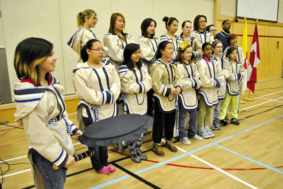 Emily-Ann Niego (far left) prepares to play her drum on the morning of April 23 as the Aqsarniit middle school choir gets ready to perform for Premier Eva Aariak and other invited guests at an assembly held to mark the start of Education Week in Nunavut. This year's theme is 