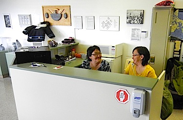 When you walk into Inuulitsivik hospital in Puvrnituq, you'll see Louisa Tulluaga and Annie Tulugak, who deal with telephone calls — in three languages — and help direct patients and visitors. (PHOTO BY JANE GEORGE)