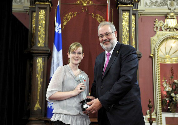 Pierre Arcand, Quebec's minister of sustainable development, environment and parks, presents a Phénix de l’environnement award, the province's top environmental award, to Nancy Dea, the co-ordinator of the Kativik Regional Government's clean-up project of abandoned mineral exploration sites, May 24 at the National Assembly in Quebec City. Between 2005 and 2011, the KRG cleaned up sites which needed major remediation work. Over the next five years, the project will expand to include other sites requiring clean-up. (PHOTO COURTESY OF THE KRG)