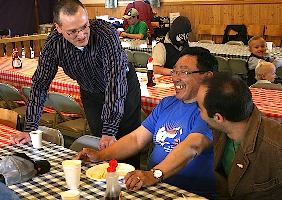 Nunavut health minister Keith Peterson drops by at the free World No Tobacco Day community breakfast held June 2 at the Anglican parish Hall in Iqaluit. There, smokers were encouraged to trade in their cigarettes for anti-smoking gifts like tee-shirts and information guides on how to quit smoking. (FILE PHOTO)