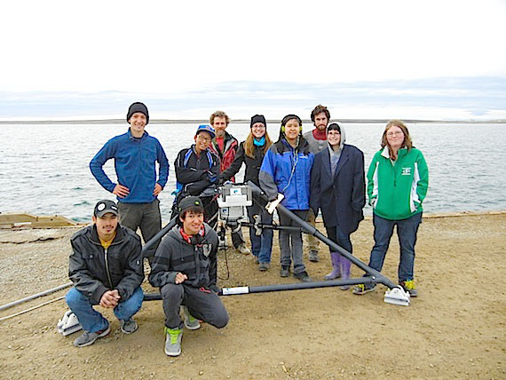 Researchers with the University of Victoria's Neptune ocean monitoring program and students in Beth Sampson's Grade 11 biology class at Cambridge Bay's Kiilinik High School stand around an triangle-shaped underwater observatory that will soon be fixed underwater near the dock in Cambridge Bay. The device, which measures such things as underwater temperature, sounds, salinity and ice thickness, is also equipped with a camera to keep an eye on the seabed. Similar observatories are also installed off the coasts of British Columbia, said researcher Martin Hofmann. This one could be the first in a series of projects to monitor changes in the Arctic. (PHOTO BY JANE GEORGE)