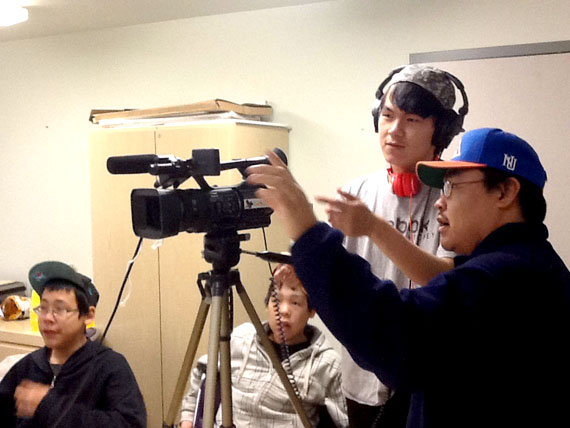 Eric Anoee Jr. shows Innosar Issakiark some tips for recording. They were interviewing youth on their perspectives on bullying during one of many evening workshops. (PHOTO COURTESY ARVIAT FILM SOCIETY) 