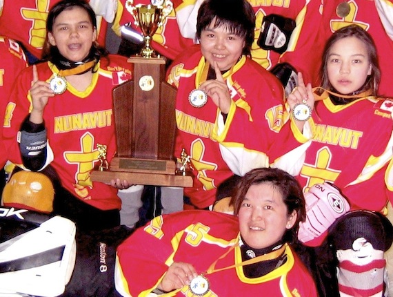 Some of Team Kivalliq's members strikes a victory pose after winning Nunavut’s first territorial women's hockey championship at Iqaluit’s Arnaitok Arena March 31. They narrowly defeated Team Baffin 9-8 to take gold. Read more about the championship later on Nunatsiaqonline.ca. (PHOTO BY PETER VARGA)