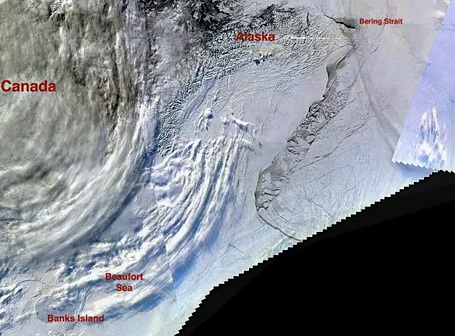 This NASA satellite image shows the crack in the Arctic sea ice which extends from Ellesmere Island to Barrow, Alaska.