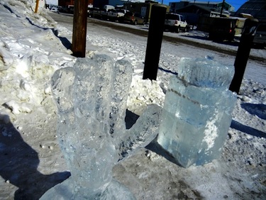 Two of the ice carvings made April 14 stand outside the RCMP V Division building where the competition took place. (PHOTO BY JANE GEORGE)