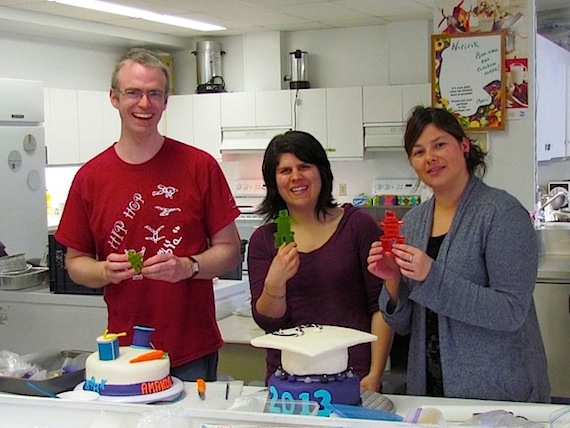 Kangiqsujuaq teachers Ben Anderson, Annie-Claude Lanielle and Kathy Potvin put the finishing touches on the 2013 Arsaniq School graduation cakes, which also featured red and green edible inuksuks. Four students celebrated their graduation from Secondary 5 on June 18. (PHOTO BY MARION JAMES)