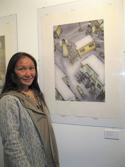 Shuvinai Ashoona welcomed visitors June 29 to the opening of Takujaksait, an exhibit of her work on display at the Nunatta Sunnakkutaangit Museum in Iqaluit for the entire summer. The print Angel in Town, shown, is one of several works Ashoona has produced in Cape Dorset.  (PHOTO by PETER VARGA)

