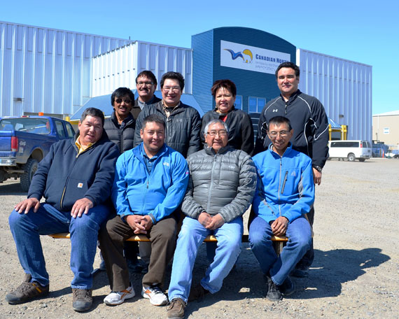 The board that oversees the Nunasi Corp. poses for a picture in front of the Canadian North cargo warehouse in Iqaluit. The new board now comprises the presidents of each regional Inuit association in Nunavut and the presidents and vice presidents of each regional development corporation. (PHOTO COURTESY OF QIA) 