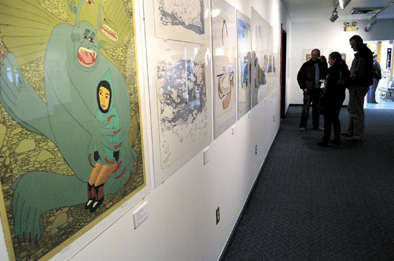 The 22 by 27-inch lithograph on the far left is called “Scary Dream,” produced in 2006. (PHOTO BY JIM BELL)