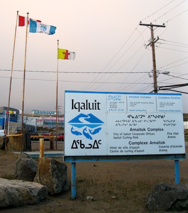 Flags fly near city hall in Iqaluit Aug. 27 after a heated city council meeting. Two Iqaluit city councillors’ objections to the reappointment of the city’s chief administration officer, John Hussey, went ignored when key city council meetings coincided with their summer vacation time. “Coincidence?” asked Coun. Terry Dobbin, whose calls for discussion were voted down Aug. 27. (PHOTO BY PETER VARGA)
