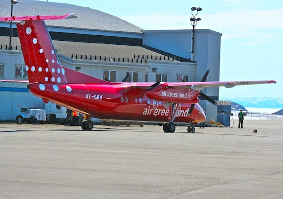 A red and white Air Greenland Dash-8 lands at Iqaluit's airport at the Iqaluit airport in 2012. The flights between Iqaluit and Nuuk will continue until the end of this September. (FILE PHOTO)