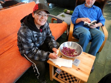 Alicia Manik, 17, of Resolute Bay, serves up purple mountain saxifrage with maple syrup at the Arctic Watch Lodge on Somerset Island in early July. (PHOTO COURTESY OF PAUL SOKOLOFF)