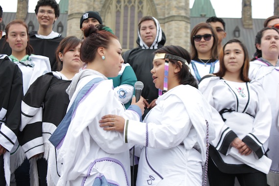 Throat singers Natashia Allakariallak, 18, of Iqaluit, left, and Shauna Seeteenak, 21, of Baker Lake, perform in front of their fellow Nunavut Sivuniksavut students on Parliament Hill Tuesday at a suicide awareness event co-hosted by ITK. Leaders praised their dedication, saying they were not tomorrow's leaders, but today's.  (PHOTO BY LISA GREGOIRE)