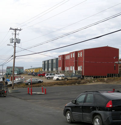 The Nunavut Housing Corp. asserts ownership of these three buildings in Iqaluit, but the city has not registered the NHC's name for the lot that the building sits on and still sends tax bills to the former owner, the NWT Métis Development Corp., which relinquished ownership in 2007 when its lease expired. The corporation has asked the city to forgive accumulated interest charges on the $336,000 bill racked up by the Métis corporation, but the city won't change its lot lease records until after the entire bill is paid. (PHOTO BY PETER VARGA) 