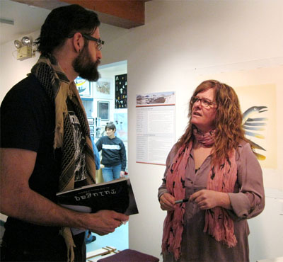 Kerry McCluskey chats with a book-buyer at the launch of Tulugaq: An Oral History of Ravens, her collection of brief legends, fables and anecdotes about Arctic ravens, at Iqaluit’s Nunavut Sunakkutaangit Museum on Nov. 23. (PHOTO BY PETER VARGA)

