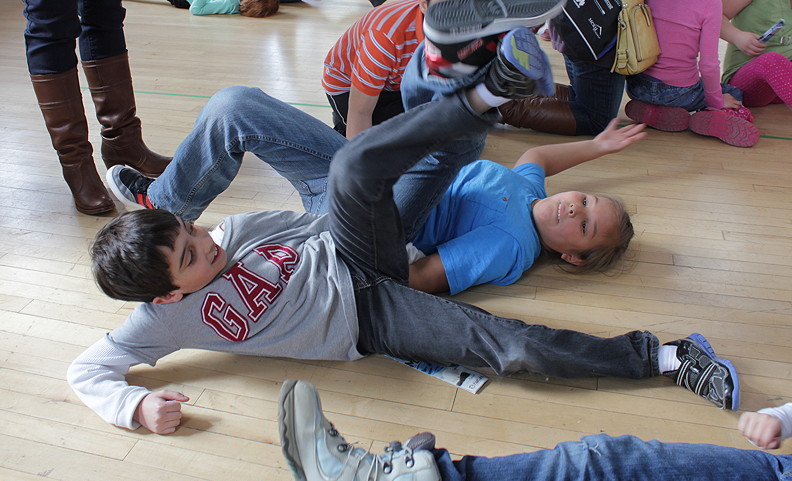 Harun, left, and Cayden, join their friends on the floor for a little Inuit leg wrestling during a school field trip to the Canadian Museum of Nature's Edible Arctic festival April 7. (PHOTO BY LISA GREGOIRE)