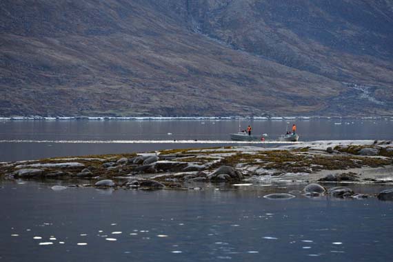 A search and rescue team including two divers from Qikiqtarjuaq head out along the shore of Pangnirtung June 30. The divers were brought in to help recover Eric Joamie, a local man who has been missing since June 19, when he was due back from a hunting trip. Dozens of people in the community have volunteered their time to search for Joamie over the last two weeks; now crews are focused on a section of water they believe the man fell into during the ice break up. (PHOTO BY DAVID KILABUK) 