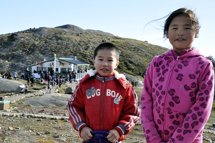 Andrew Ma, 7, and Mary Aokaut, 10, take a break from playing Frisbee Sept. 1 to pose for a photo at the Sylvia Grinnell barbecue near Iqaluit, held annually on Labour Day to thank public service workers. The event was sponsored by the Public Service Alliance of Canada Nunavut Area Council and the Northern Territories Federation of Labour. Aokaut said she had some energy to burn off, having consumed two hot dogs and two hamburgers. (PHOTO BY THOMAS ROHNER)