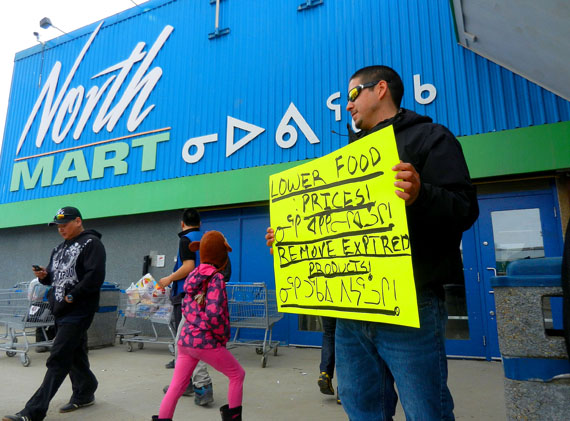 Iqaluit resident Luc Peter in May 2012, conducting a one-man food price protest at the NWC's Northmart store in Iqaluit. (FILE PHOTO)