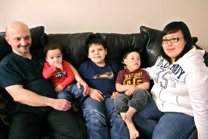 Ches Pye, Benjamin Pye, Tyrell Pye, Brennan Koblogina-Pye, Clarissa Koblogina sit together at their home in the western Nunavut town on Cambridge Bay. Brennan, who  was born with Down syndrome five years ago, is helping everyone in the community learn more about this genetic disorder. “He’s doing so good,” said Brennan’s father, Ches Pye. “Every time we have an [individual education plan] meeting, there’s no negativity. It’s all progress.” Read more about Brennan and how Cambridge Bay is helping that progress along later on Nunatsiaq News. (PHOTO BY KELCEY WRIGHT)