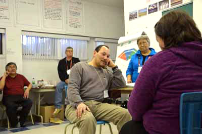 Salluit first responder Michael Cameron sits with an ASIST trainer during a workshop help in the Hudson Strait community last week. Salluit recently saw a cluster of five suicides over a two-month period. (PHOTO BY KATSUAK SAVIADJUK) 