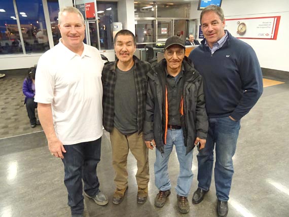 Nunavik hockey fans Tumasi Snowball and Willie Tukkiapik stand with former NHLers Marty McSorley, left, and John Leclair, right, at the Montreal airport March 27. The two hockey stars were accompanying the Stanley Cup to Kuujjuaq this morning, where it will be on display for the first time at the Kuujjuaq forum from 10:00 a.m. until noon. As part of the event, Scotiabank, First Air and Project North will donate 25 hockey bags to Nunavik youth. The cup travels north to Iqaluit later on March 27, where it will be displayed at the Arctic Winter Games arena between 4 p.m. and 6 p.m. Attendance is free. At 6 p.m., a VIP hockey game — tickets required — will start at the AWG arena. On March 28, between 11 a.m. and 3 p.m., children and others will be able to have their photo taken with Lord Stanley's Cup at the AWG arena. (PHOTO BY JANE GEORGE)