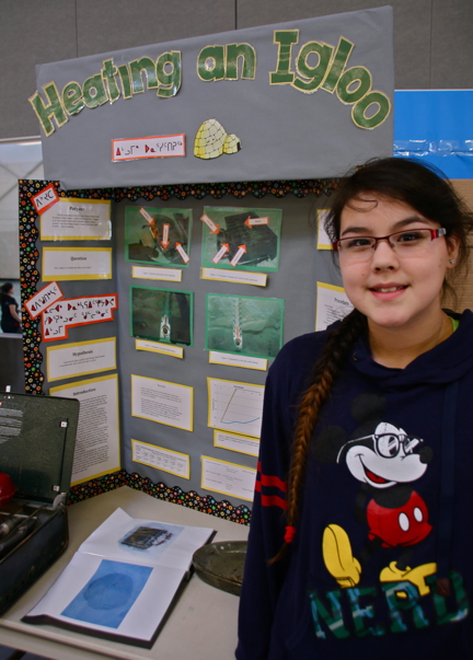 Alaira Sallerina shows off her science project on heating an igloo. The young scientist gained full points for Northern Applicability during judging. (PHOTO BY KELCEY WRIGHT)