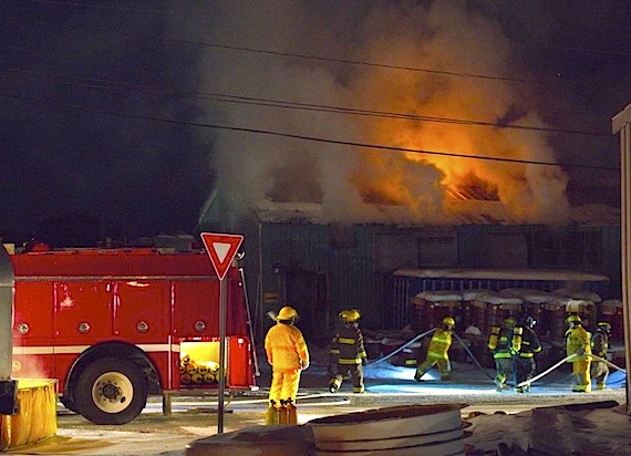Firefighters in Pangnirtung battle the early morning April 2 blaze which knocked out power to the community. (PHOTO BY DAVID KILABUK)