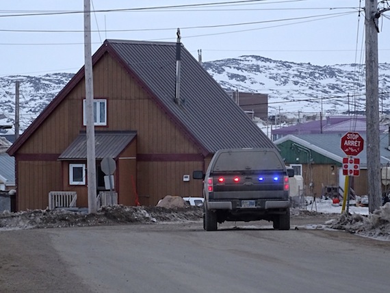A municipal enforcement vehicle idling at one of the entrances to Iqaluit's Happy Valley neighbourhood at 5:30 a.m. April 30 to keep traffic from entering the perimeter of the lock-down area. (PHOTO BY JANE GEORGE)