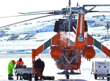 Equipment bound for Pangnirtung is lorded on a Sikorsky S-64F Skycrane helicopter April 15 at the Iqaluit airport. (PHOTO BY THOMAS ROHNER)