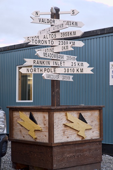 This signpost at Agnico Eagle's Meliadine gold mine project shows how far the central Nunavut site lies from other places where Agnico Eagle does business. (PHOTO COURTESY OF AEM)